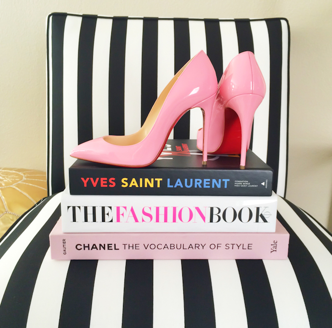 Striped accent chair Christian Louboutin pigalle follies pink pumps YSL book Chanel book The Fashion Book