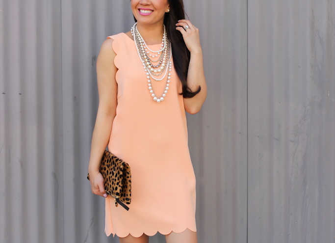 Ann Taylor crystal pearlized statement necklace Clare V leopard foldover clutch Urban Outfitters scallop shift dress