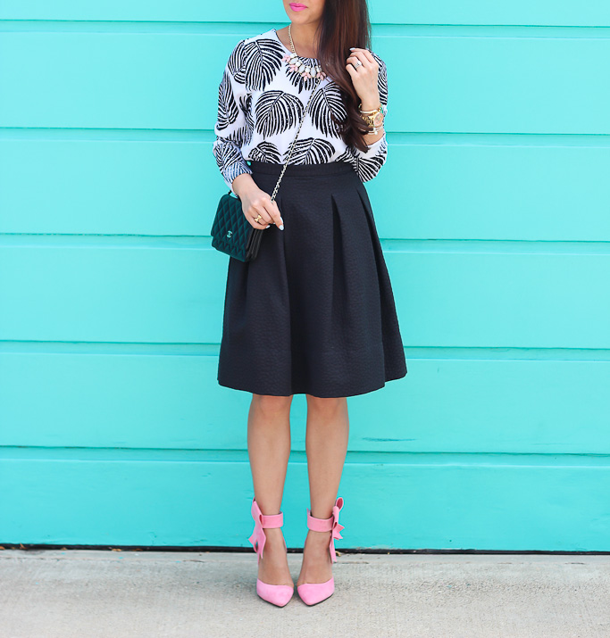 ankle bow shoes black pleated flare skirt bow heels bow pumps BP leaf necklace Chanel WOC palm print blouse pink bow pumps Sheinside Black Long Sleeve Leaves Print Dipped Hem Blouse