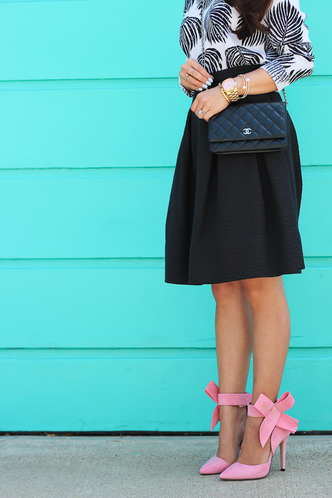 ankle bow shoes black pleated flare skirt bow heels bow pumps BP leaf necklace Chanel WOC palm print blouse pink bow pumps Sheinside Black Long Sleeve Leaves Print Dipped Hem Blouse