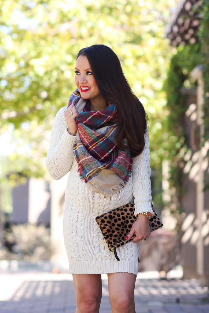 6 ways to wear a plaid blanket scarf, Clare V leopard foldover clutch, Fall outfit, Loft cognac bow belt, Mac ruby woo red lipstick, Nordstrom cable knit sweater drses, Petite maternity outfits p, plaid blanket scarf, Vince Camuto franell western ankle booties