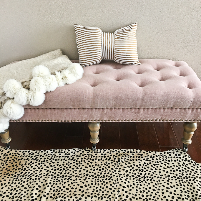 Cheetah leopard rug, Isabelle Upholstered Bedroom Bench by Linon, Nordstrom pom pom throw blanket, Xhilaration gold striped bow pillow