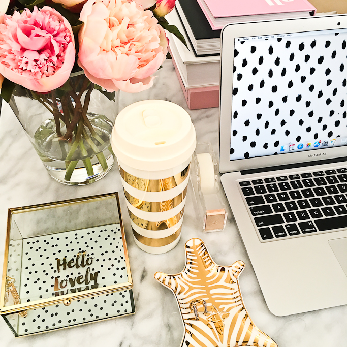 Apple mac laptop, Jonthan Adler Metallic zebra dish, Kate Spade gold striped coffee mug, Kate Spade tape dispenser, Oval marble coffee table, Pink peonies, Target hello lovely jewelry box