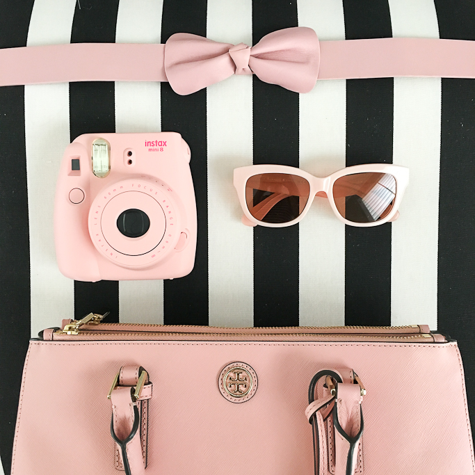 Fujifilm Instax Mini 8 Camera pink, Kate Spade pink sunglasses, Kate Spade pink bow belt, Tory Burch mini Robinson in rose pink