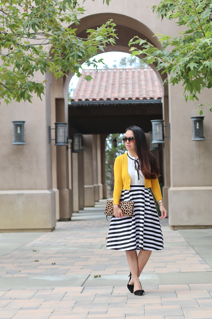 Ann Taylor odette bow pumps, Clare V leopard foldover clutch, Modcloth dusk and stunner skirt, Modcloth refreshing routine top, striped flare skirt, The Dream of the Crop Cardigan in Honey