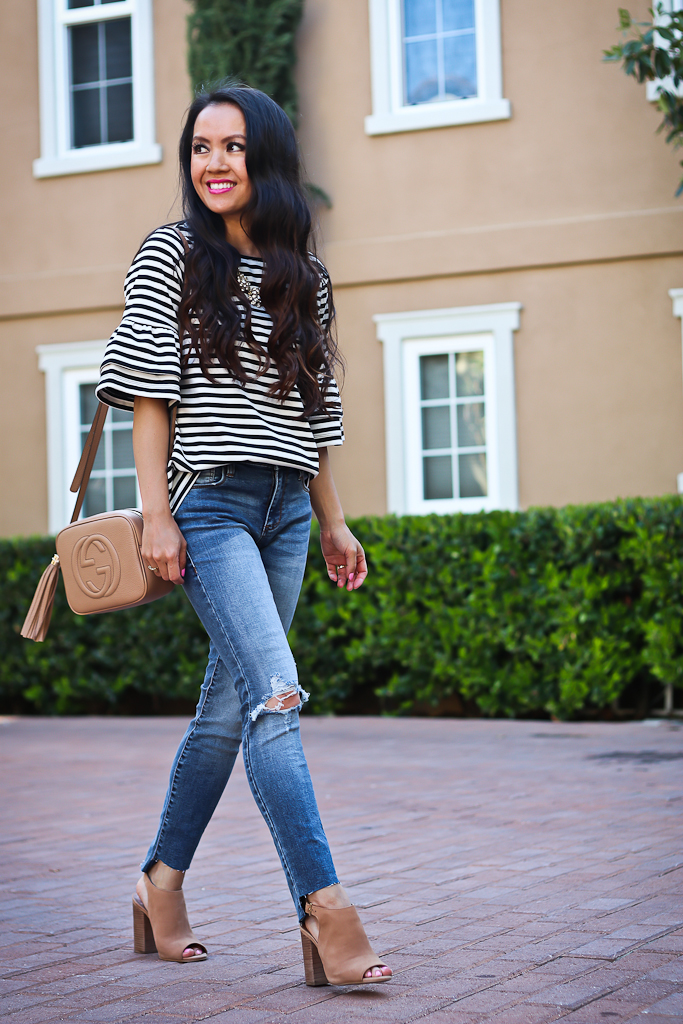striped flounce sleeve top casual weekend outfit step hem jeans soho disco bag