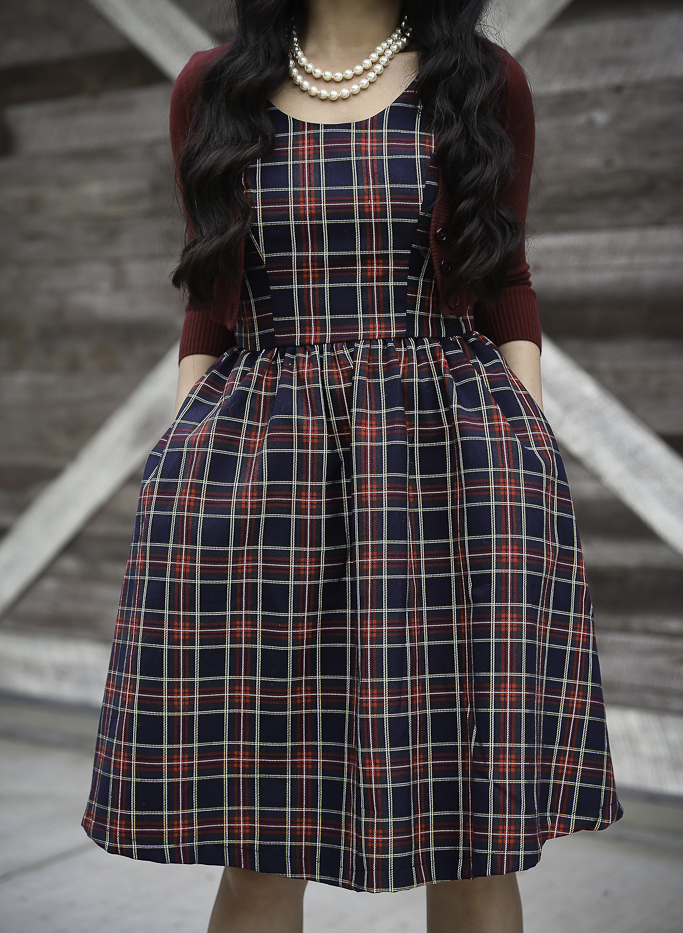 holiday outfit idea plaid dress with pockets cropped cardigan bow pumps chunky knit hat