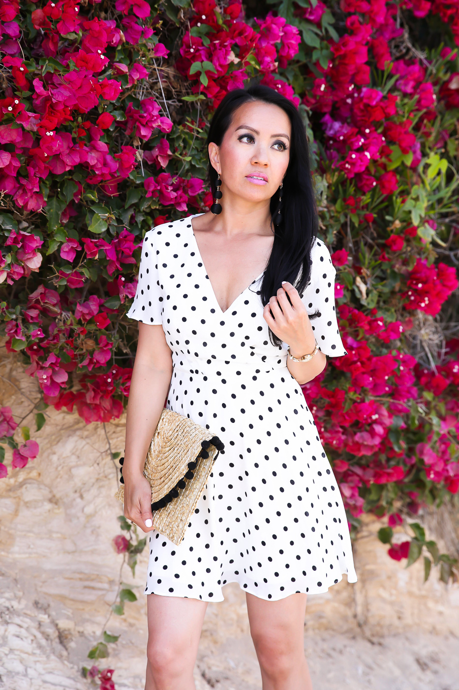 polka dot flutter sleeve fit and flare dress pom trim straw clutch summer outfit
