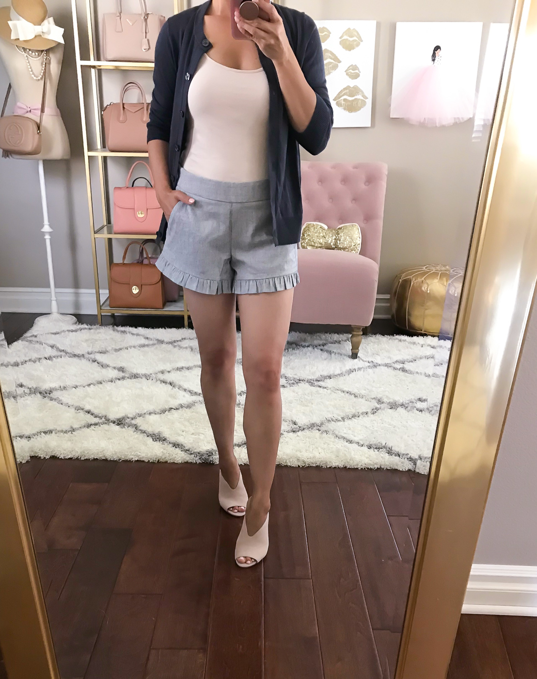 ruffle shorts pink mules summer outfit idea navy cardigan