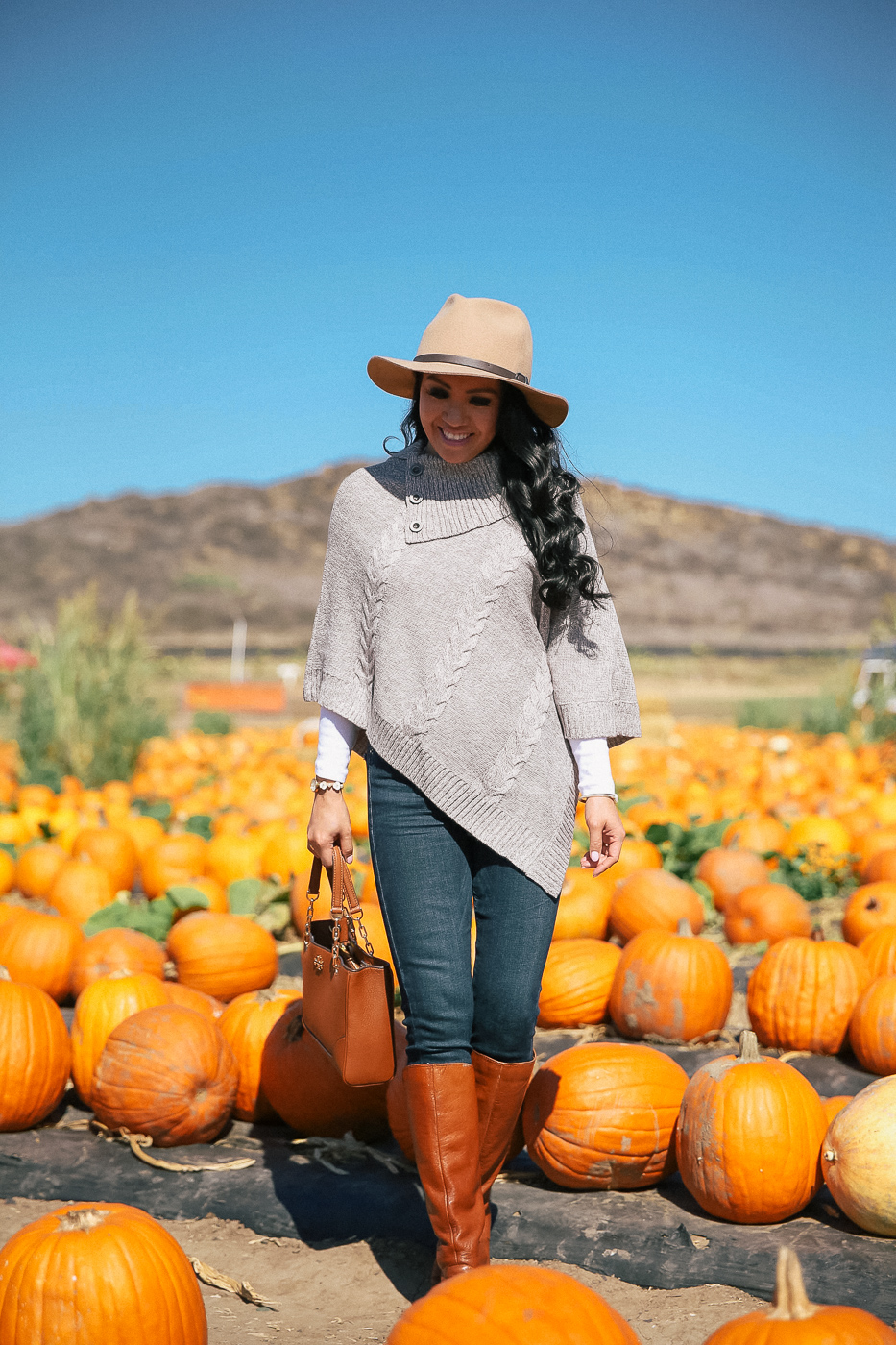 petite poncho skinny jeans cognac boots wool hat fall outfit