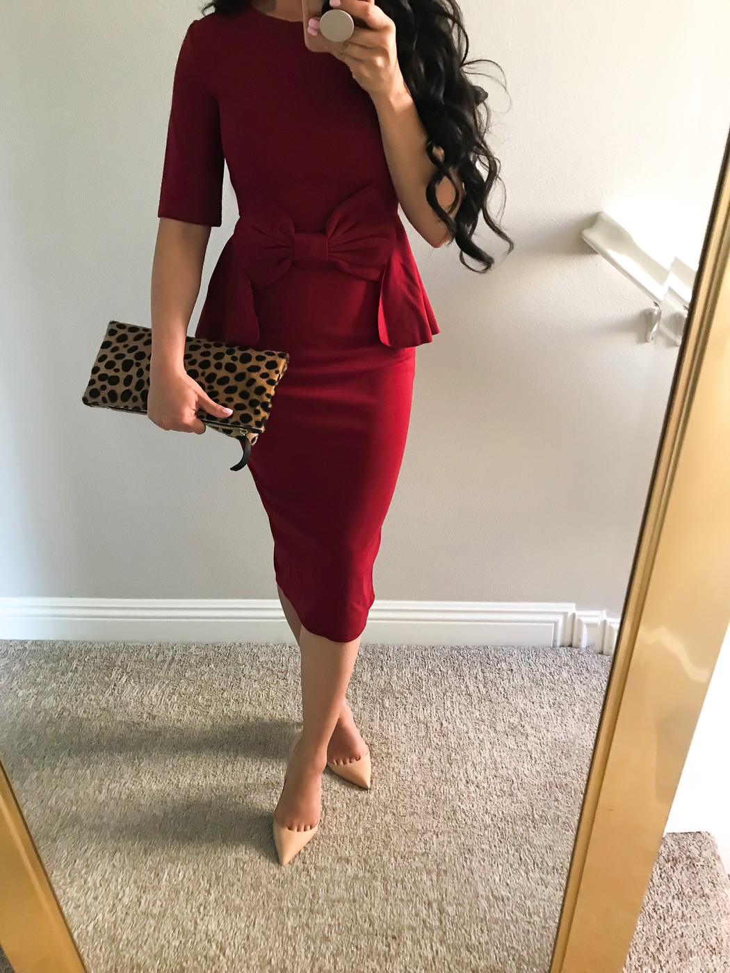 burgundy bow pencil dress holiday outfit idea leopard clutch
