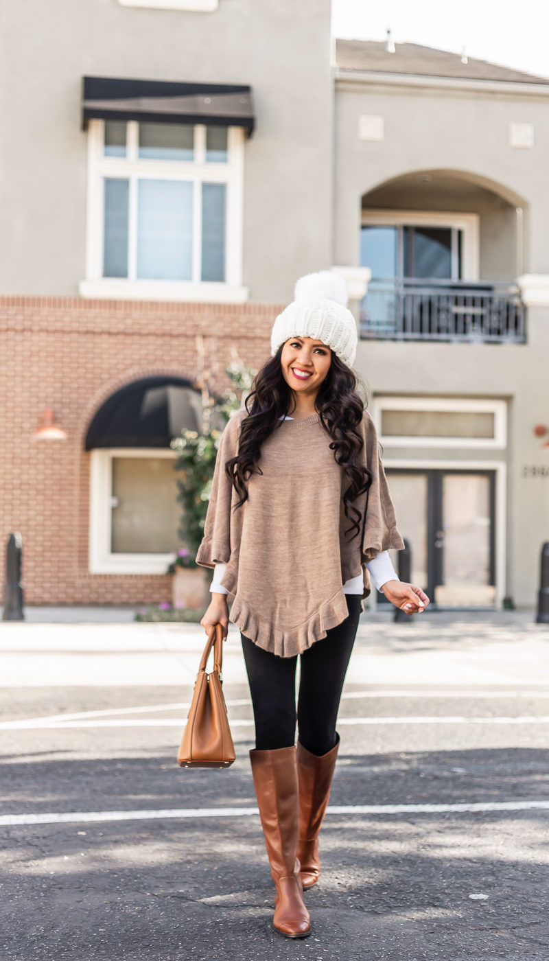 Ruffled Poncho black leggings cognac boots pom pom beanie