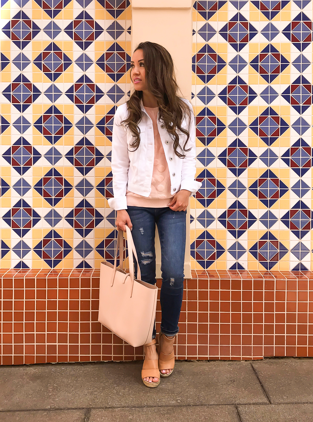 white denim jacket distressed jeans blush tote pink sweater casual outfit