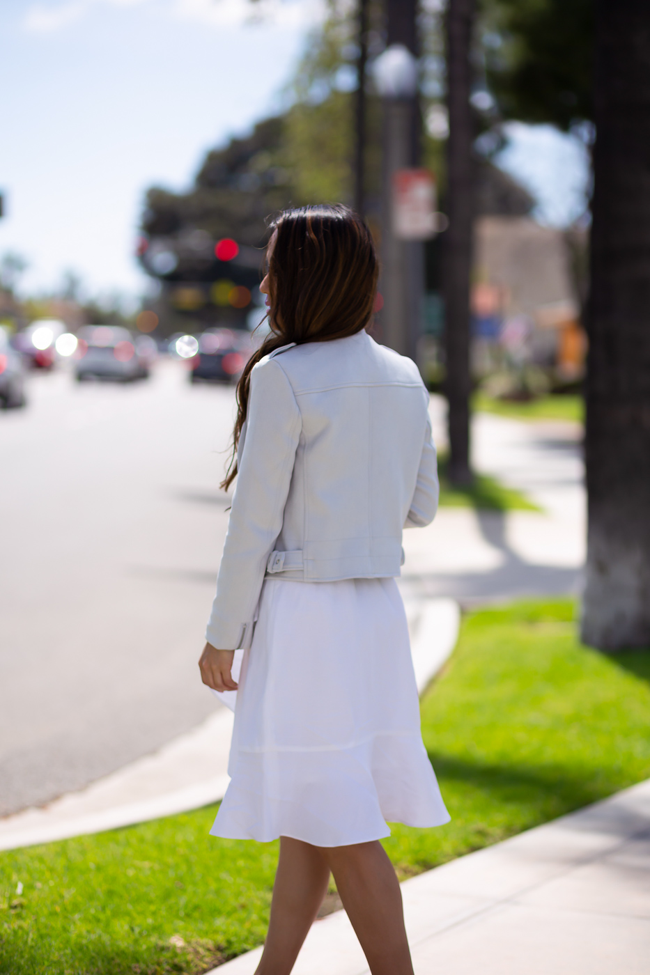 white linen wrap ruffle dress vegan leather moto jacket spring outfit