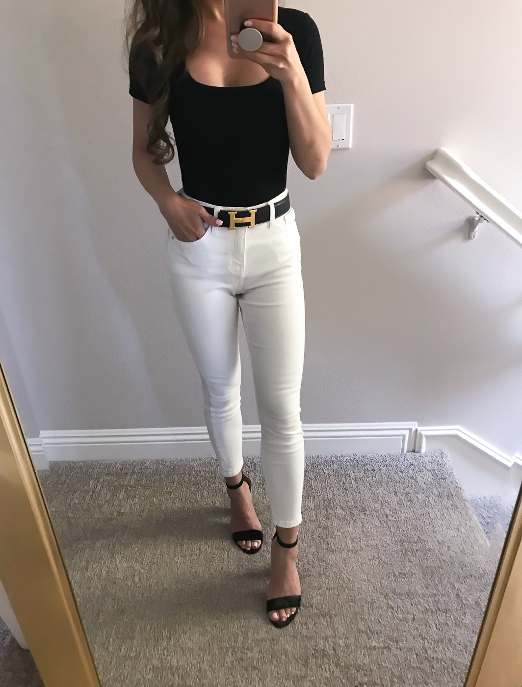 white jeans black bodysuit hermes belt