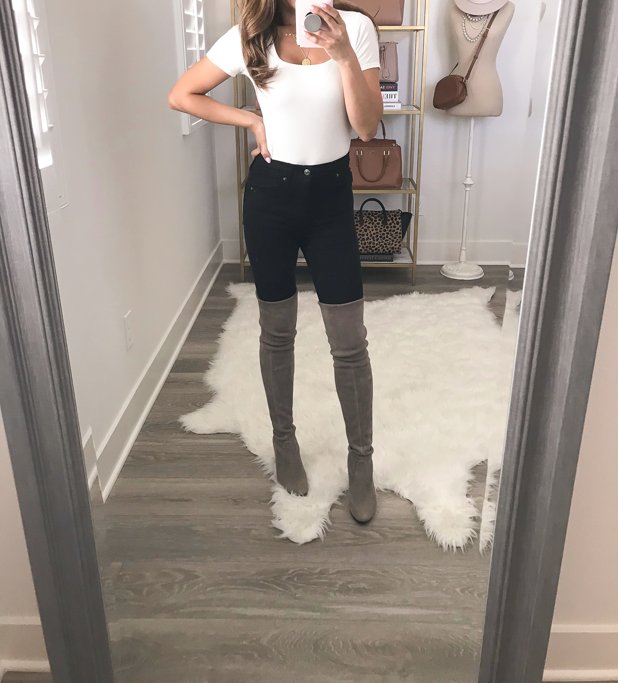 white bodysuit black distressed jeans stuart weitzman highland over the knee boots